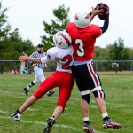 Trevor Gerig wins the battle for a pass in the JV game.