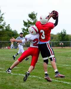 Trevor Gerig wins the battle for a pass in the JV game.